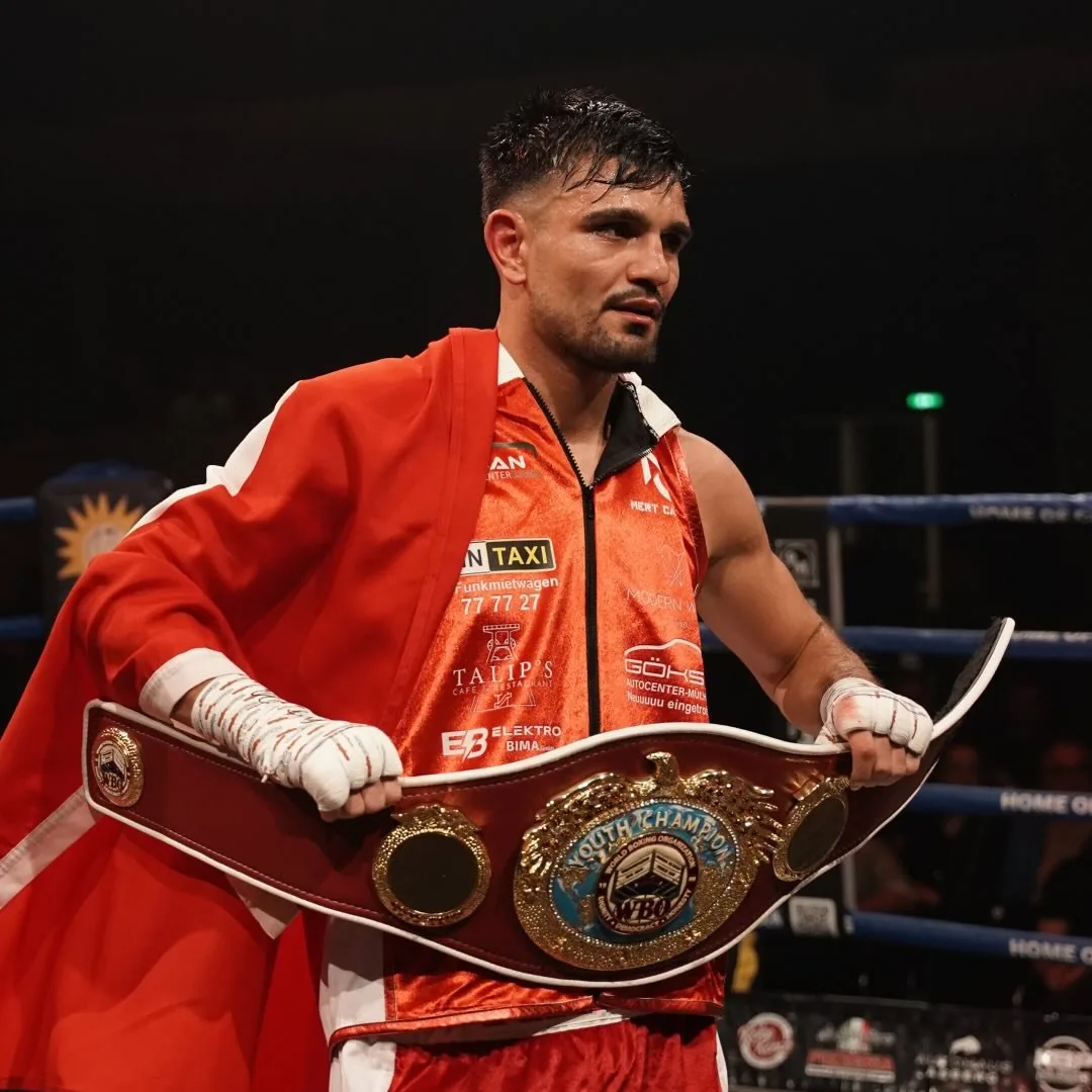 Mert Caliskan with the WBO Youth Champion belt